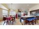 Open floor plan: the dining area flows into the kitchen with modern appliances and island seating at 2845 E Calavar Rd, Phoenix, AZ 85032