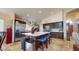 This kitchen features a large island with seating, stainless steel appliances, and dark cabinets at 2845 E Calavar Rd, Phoenix, AZ 85032