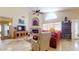 Inviting living room features a stone fireplace, TV, and comfortable seating for relaxing and entertaining at 2845 E Calavar Rd, Phoenix, AZ 85032