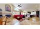 The living room boasts a fireplace, large windows, and seamless flow to kitchen, creating a great space at 2845 E Calavar Rd, Phoenix, AZ 85032