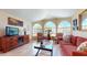 Spacious living room with arched windows and neutral tones at 2845 E Calavar Rd, Phoenix, AZ 85032
