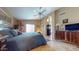 Cozy main bedroom features a plush bed, ceiling fan, and comfortable furnishings at 2845 E Calavar Rd, Phoenix, AZ 85032