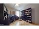 Home office with built-in bookshelves and large desk area at 2845 E Calavar Rd, Phoenix, AZ 85032