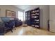 Home office with built-in bookshelves and large desk area at 2845 E Calavar Rd, Phoenix, AZ 85032