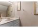 Bathroom vanity features light countertops and framed mirror at 2941 N Oregon St # 12, Chandler, AZ 85225