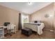 Cozy bedroom with neutral carpet and a window bringing in natural light at 2941 N Oregon St # 12, Chandler, AZ 85225