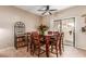 Cozy dining area with seating for eight, a wine rack, and sliding glass door leading to the patio at 2941 N Oregon St # 12, Chandler, AZ 85225