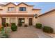 Inviting townhome with well-manicured desert landscaping and a traditional red tile roof at 2941 N Oregon St # 12, Chandler, AZ 85225