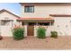 Charming home with orange tile roof, stucco walls, and decorative orange flowering bushes at 2941 N Oregon St # 12, Chandler, AZ 85225
