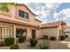 Inviting townhouse featuring desert landscaping, a red tile roof, and a well-maintained exterior at 2941 N Oregon St # 12, Chandler, AZ 85225