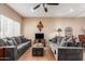 Comfortable living room featuring tile flooring, neutral paint, and dual plush grey sofas at 2941 N Oregon St # 12, Chandler, AZ 85225