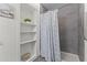 Bathroom showcasing a modern bathtub, shower, and shelving at 3307 W Willow Ave, Phoenix, AZ 85029