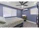 Comfortable bedroom featuring neutral decor, ample natural light, and a ceiling fan at 3307 W Willow Ave, Phoenix, AZ 85029