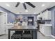 Modern kitchen boasting white cabinetry, a spacious island, and stainless steel appliances at 3307 W Willow Ave, Phoenix, AZ 85029
