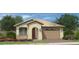Charming single-story home featuring a tile roof, arched entryway, two-car garage and low maintenance desert landscaping at 35017 N Sacramento Wash Rd, San Tan Valley, AZ 85144