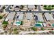 Aerial shot of houses with pools and solar panels in a community with desert landscaping at 3529 N Brooklyn Dr, Buckeye, AZ 85396