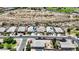 An aerial view displays a neighborhood with well-maintained homes, desert landscaping and community features at 3529 N Brooklyn Dr, Buckeye, AZ 85396