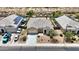 An aerial view of a beautiful single Gathering home, solar panels, desert landscaping, and private pool at 3529 N Brooklyn Dr, Buckeye, AZ 85396