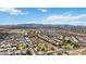 An aerial shot showcases a community with homes, mountain views, and a desert setting at 3529 N Brooklyn Dr, Buckeye, AZ 85396