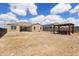 Expansive backyard featuring a covered gazebo and the home's facade against a blue sky at 3529 N Brooklyn Dr, Buckeye, AZ 85396
