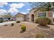 Charming single-story home with a two car garage, long driveway, and desert style landscaping at 3529 N Brooklyn Dr, Buckeye, AZ 85396