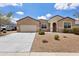 Charming single-story home with a two car garage, low maintenance landscaping and desert style yard at 3529 N Brooklyn Dr, Buckeye, AZ 85396