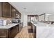 Modern kitchen featuring stainless steel appliances, ample counter space, and stylish cabinetry at 3529 N Brooklyn Dr, Buckeye, AZ 85396