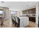 Modern kitchen with a large island and comfortable barstool seating plus stainless steel appliances at 3529 N Brooklyn Dr, Buckeye, AZ 85396