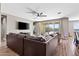 Spacious living room with hardwood floors and sliding glass doors to outdoor area at 3529 N Brooklyn Dr, Buckeye, AZ 85396