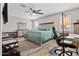 Spacious main bedroom featuring a ceiling fan and neutral decor with wood-look flooring at 3529 N Brooklyn Dr, Buckeye, AZ 85396