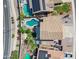 Aerial view showcasing backyard pools, desert landscaping, and solar panels of the property in a suburban neighborhood at 3905 S Bridal Vail Dr, Gilbert, AZ 85297