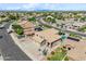 Beautiful aerial view of a suburban community showcasing houses with pools, lush landscaping, and streets under a sunny sky at 3905 S Bridal Vail Dr, Gilbert, AZ 85297