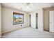 Bedroom featuring carpeted flooring, a ceiling fan, and a closet at 3905 S Bridal Vail Dr, Gilbert, AZ 85297