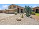 Charming two-story home with desert landscaping, a three-car garage, and inviting curb appeal in a sunny neighborhood at 3905 S Bridal Vail Dr, Gilbert, AZ 85297