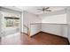 Upstairs loft with hardwood floors, view to outdoor, ceiling fan at 3905 S Bridal Vail Dr, Gilbert, AZ 85297