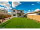 Spacious backyard with lush green lawn, offering plenty of room for outdoor activities and relaxation at 40445 W Bravo Dr, Maricopa, AZ 85138