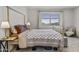 Serene bedroom with a cozy bed, neutral tones, and a peaceful ambiance at 40445 W Bravo Dr, Maricopa, AZ 85138