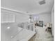 Bright loft area with plush carpeting, neutral walls, and plenty of natural light for a great play area at 40445 W Bravo Dr, Maricopa, AZ 85138