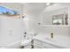 Bright bathroom featuring a shower/tub combo, quartz countertops and a view from the exterior window at 4121 E Patrick St, Gilbert, AZ 85295