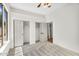 Bright bedroom featuring gray carpeting, neutral paint, and an entrance to the ensuite bathroom at 4121 E Patrick St, Gilbert, AZ 85295