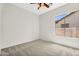 Cozy bedroom featuring neutral walls, plush carpeting, and a bright window at 4121 E Patrick St, Gilbert, AZ 85295