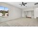 Bright bedroom with a ceiling fan and a large window view of the pool at 4121 E Patrick St, Gilbert, AZ 85295