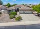 Well-maintained home with a three-car garage, landscaped yard, and a welcoming entrance at 4121 E Patrick St, Gilbert, AZ 85295