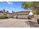 Three-car garage with a spacious driveway, offering ample parking and storage at 4121 E Patrick St, Gilbert, AZ 85295