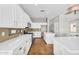 Bright kitchen featuring white cabinetry, quartz countertops, and stainless steel appliances at 4121 E Patrick St, Gilbert, AZ 85295