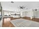 Open-concept living room with lots of natural light and a ceiling fan at 4121 E Patrick St, Gilbert, AZ 85295