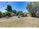 Spacious backyard featuring a plunge pool with a wooden deck, landscaping, and block fence at 4443 W Escuda Dr, Glendale, AZ 85308