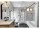 Beautifully remodeled bathroom featuring modern fixtures, marble tiling, and a standalone tub at 4443 W Escuda Dr, Glendale, AZ 85308