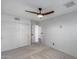 Light and airy bedroom with ceiling fan, closet, and neutral carpet for a cozy feel at 4443 W Escuda Dr, Glendale, AZ 85308