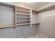Walk-in closet featuring built-in shelving and ample storage space at 4443 W Escuda Dr, Glendale, AZ 85308
